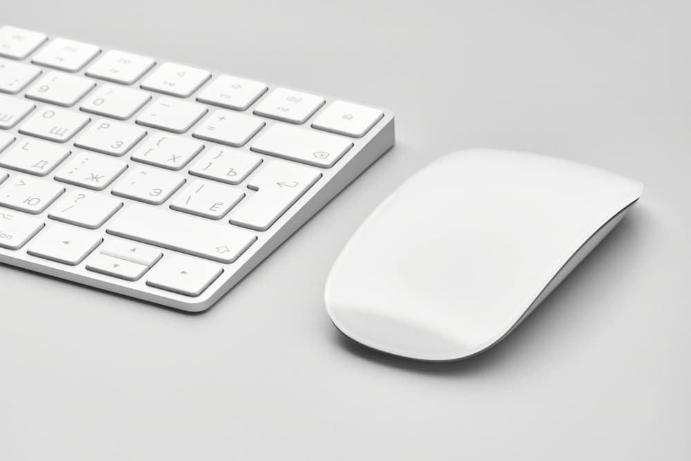A clean desk with a keyboard and mouse